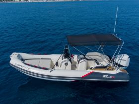 A sleek speedboat captured from above, gliding through crystal-clear waters — perfect for thrilling adventures on the open sea.