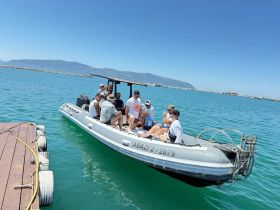 A lively group enjoys a day on the water aboard a boat, perfect for socializing and adventure under the sun.