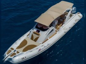 Aerial view of a sleek speedboat cruising through deep blue waters, showcasing its elegant design and spacious seating — perfect for thrilling adventures on the water.