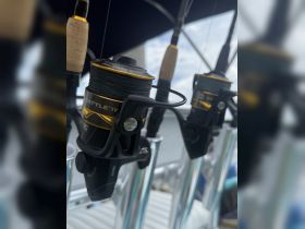 Close-up of high-quality fishing reels mounted on a boat, showcasing essential gear for an exciting day of fishing on the water.