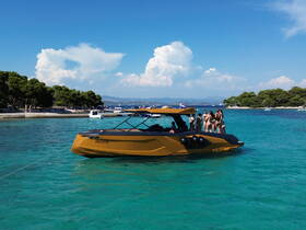 A lively group enjoys a day on the water aboard a stylish boat, perfect for summer parties and beach outings.