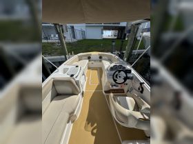 A well-appointed helm area of a NauticStar boat, showcasing comfortable seating and modern controls, perfect for a day on the water.