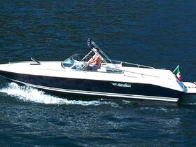 A sleek speedboat glides through the water, showcasing an exhilarating day on the lake — perfect for adventure seekers and water enthusiasts.