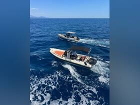 Two speedboats navigate through the vibrant blue waters, showcasing an exciting day on the water — perfect for adventure seekers and boat enthusiasts.