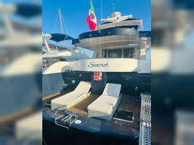 A stunning view of the yacht 'Seacret' docked, showcasing its elegant design and inviting lounge area — perfect for relaxation on the water.