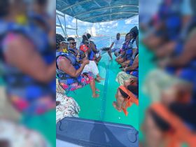 A lively group enjoys drinks aboard a boat, showcasing the fun and camaraderie of a memorable day on the water.