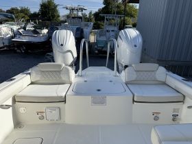 Interior view of a boat's seating area, showcasing comfortable helm and console design — ideal for relaxing while cruising.