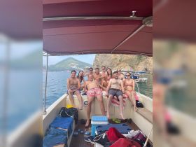 A lively group of friends enjoys a fun day on the boat, soaking up the sun and creating unforgettable memories on the water.