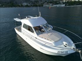 A sleek yacht docked in calm waters, showcasing its elegant design and structure — perfect for luxury boating experiences.