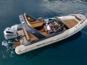 A couple enjoys a scenic ride on a sleek boat, showcasing the perfect blend of adventure and relaxation on the water.