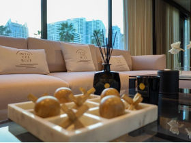 A stylish lounge area inside a boat, featuring elegant decor and comfortable seating, perfect for relaxation while enjoying the views.