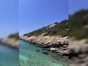 A stunning view of a rocky coastline with crystal-clear waters, perfect for exploring the natural beauty of the area.