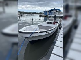 A well-maintained boat docked at the marina, showcasing its sleek design and readiness for water adventures.