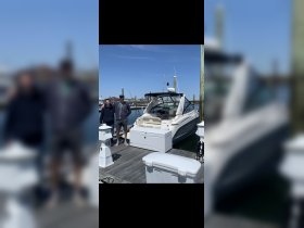 Two friends pose on the dock beside their boat, ready for a day of adventure on the water. Perfect for group outings and memorable experiences.
