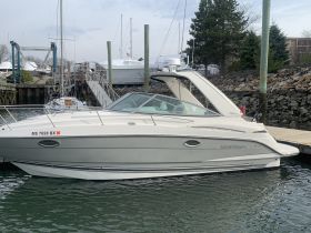 A sleek Monterey boat docked at the marina, showcasing its elegant design and ready for a day on the water.