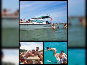 A lively group enjoys a fun day on the water with swimming and laughter around their AXÖPAR24 boat, capturing the essence of a perfect summer outing.