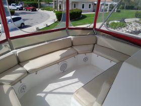 Interior view of a boat's seating area, featuring comfortable cushions and ample space for relaxation. Ideal for enjoying the ride in comfort.