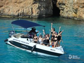 A lively group of friends celebrates on a boat, enjoying the sun and water — perfect for private charters and unforgettable summer outings.