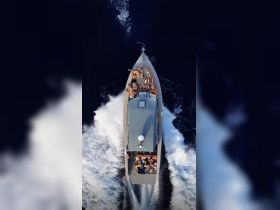 A lively group enjoys a thrilling ride on a speedboat, showcasing the excitement of on-water adventures with friends.