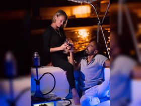A couple enjoys a romantic evening on a boat, toasting with glasses of wine under the stars — perfect for intimate celebrations or date nights on the water.