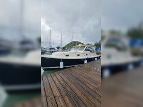 A sleek yacht docked at the marina, showcasing its elegant design and ready for the next adventure on the water.