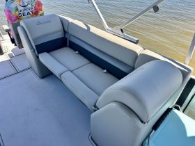 A comfortable seating area inside a Barletta boat, perfect for relaxing while enjoying a day on the water.