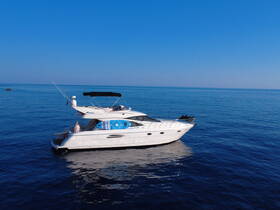 A beautiful yacht glides through calm waters, with a guest enjoying the view — perfect for luxury boating experiences.