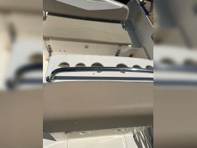 Interior view of a boat's seating area, showcasing comfortable helm and seating arrangements, perfect for a day on the water.