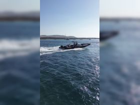 A lively group enjoys a thrilling ride on a speedboat, showcasing the excitement of on-water adventures.
