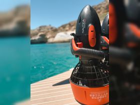 Close-up of Nautica marine equipment displayed on a boat deck, showcasing essential gear for water activities in a picturesque setting.