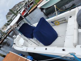 Interior view of a boat's helm and seating area, showcasing the clean and functional design, perfect for fishing or leisure outings.