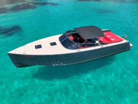 A stunning aerial view of a sleek speedboat gliding through crystal-clear turquoise waters, perfect for luxury outings and water adventures.