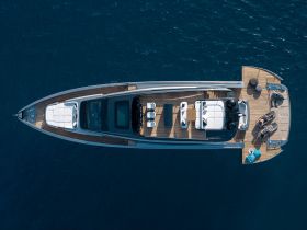 A stunning aerial view of a luxurious yacht showcasing its sleek design and spacious deck, perfect for enjoying the open water.