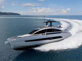 A sleek yacht cuts through the water, showcasing its modern design and powerful performance — perfect for luxury cruising on open waters.