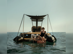 A couple enjoys a relaxing moment on their boat with a dog, creating a perfect backdrop for a memorable day on the water.