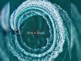 Aerial view of a speedboat creating a stunning wake pattern in the turquoise waters, showcasing the thrill of yachting adventures.