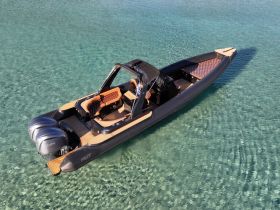 A stunning aerial view of a sleek speedboat gliding through crystal-clear waters, showcasing its modern design and luxurious seating.