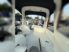 Interior view of a boat's helm and seating area, showcasing a clean and spacious design ideal for comfortable cruising.