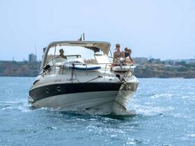 A lively scene aboard a yacht with guests enjoying the ride on the water, showcasing the perfect blend of relaxation and adventure.