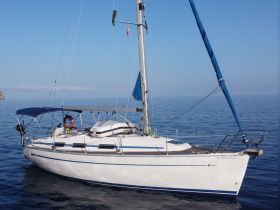 A beautiful sailboat gliding through calm waters, showcasing its sleek design and vibrant sails — perfect for sailing enthusiasts and adventure seekers.