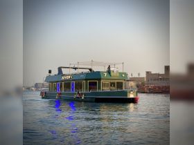 A stylish boat named 'Seven' glides through the water, showcasing its unique design and vibrant lighting — perfect for memorable outings on the water.