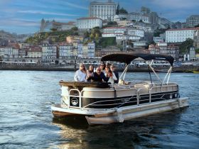 A cheerful group enjoys a scenic boat ride on a pontoon, with a vibrant cityscape in the background — perfect for memorable outings on the water.
