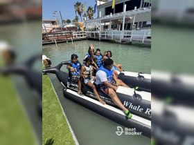 A lively group enjoys a fun-filled day on a jet ski, showcasing excitement and camaraderie in the water — perfect for adventure seekers.