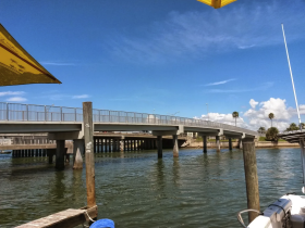 An unclear view of a bridge over water, with no identifiable subjects or activities.