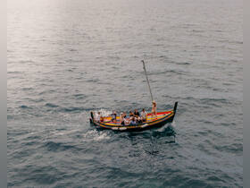 A lively group enjoys a boat ride on the open water, showcasing the joy of shared experiences and adventure at sea.