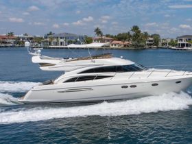 A stunning yacht glides through calm waters, showcasing its sleek design and elegance — perfect for luxury cruising.
