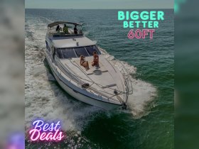 A group enjoys a sunny day aboard a 60ft yacht, perfect for relaxation and fun on the water.