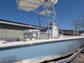 A detailed view of a sleek boat showcasing its structure and design, perfect for fishing or leisure activities on the water.