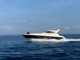 A sleek yacht cruising through calm waters, showcasing its elegant design and speed — perfect for luxury outings on the sea.