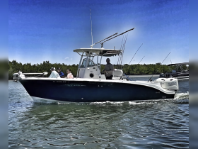 A group enjoys a day on the water aboard a fishing boat, showcasing the fun of on-water activities and camaraderie.